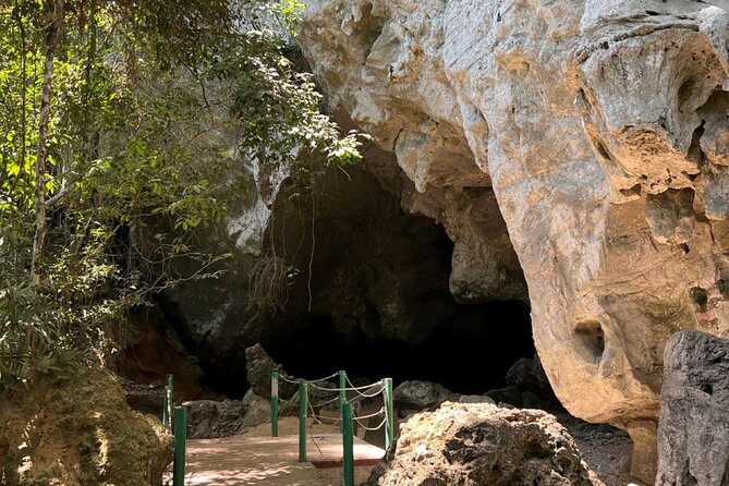 Mangrove River Cruise and Snorkeling Tour from Langkawi - Entering Pinang Cave and looking into the rock