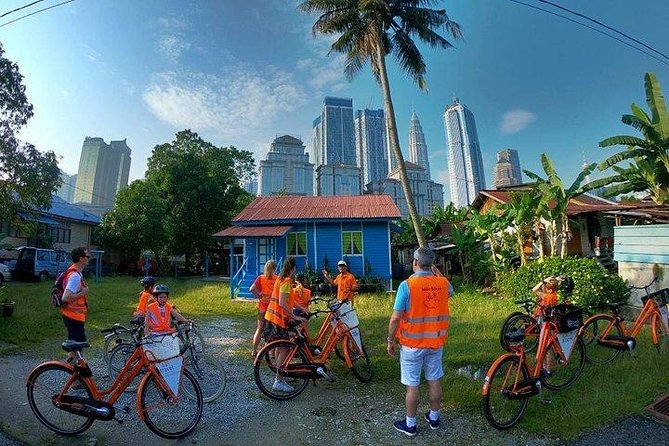 The Best of Kuala Lumpur Classic - Kampong Bharu shows old Malay life beside the towers